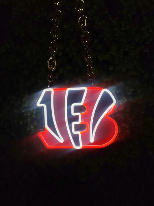 The neon sign of the NFL Cincinnati Bengals team logo is made by neonfanscrafts. It can also meet these needs of yours: a neon sign for your bar, a neon sign illustration, and ideas for a wedding neon sign.