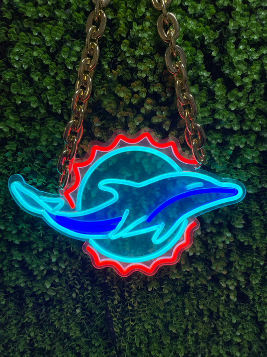 The customized neon necklace with the logo of the NFL Miami Dolphins team is produced by neonfanscrafts. It can also meet these requirements: custom fluorescent signs, a custom fluorescent sign, custom-designed neon signs, red card (it's not clear in this context what "red card" exactly refers to in relation to signs, but I translate it as is here), and personalized LED signs.